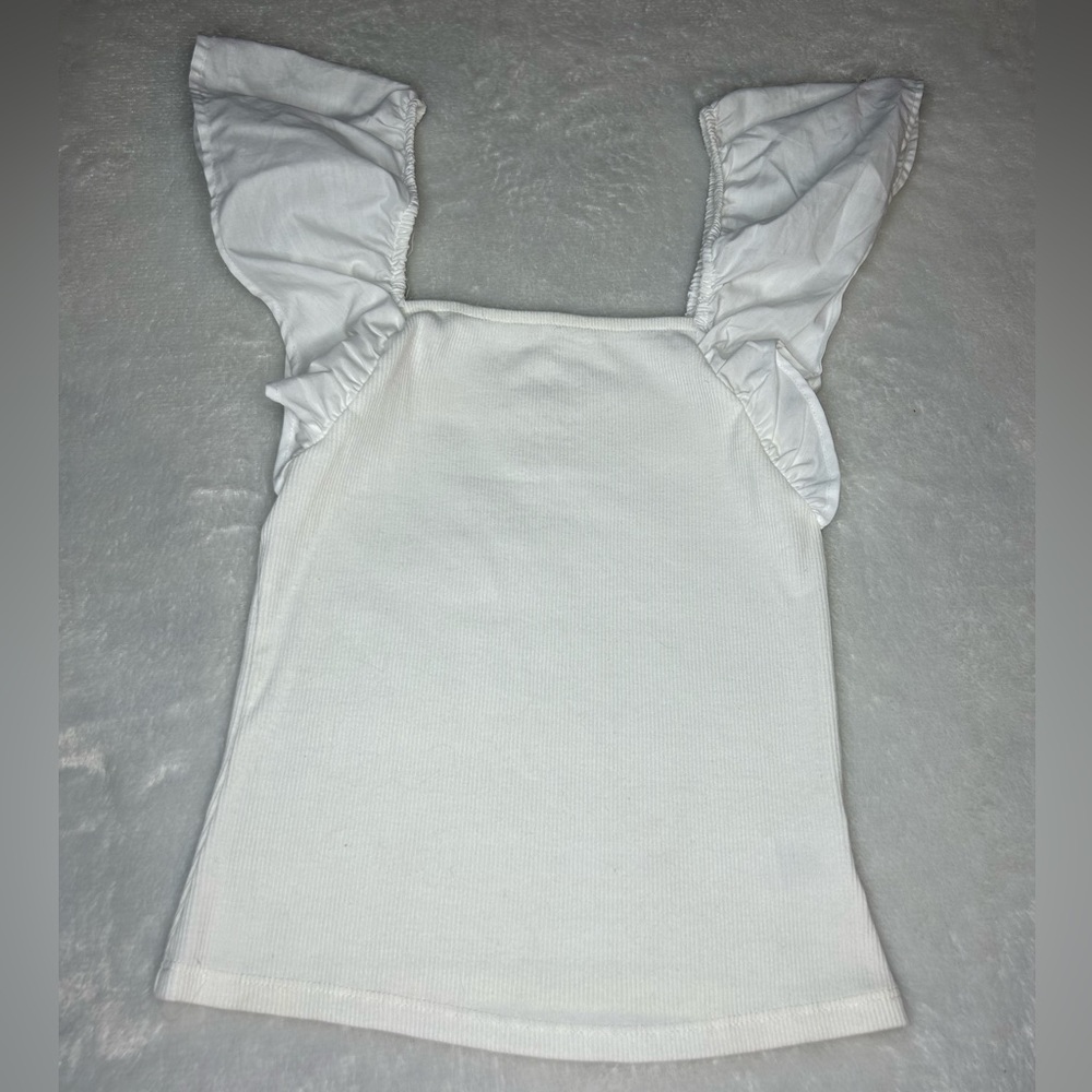 White tank with ruffled sleeves